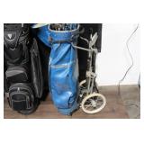 Collection of Vintage Golf Clubs with Bags and Pull Cart