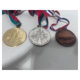 Three Special Olympics Metals Gold Silver and Bronze