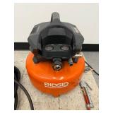 Ridgid 6 Gallon 150 PSI Pancake Air Compressor with Hose and Inflation Gun