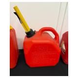 Group of 4 Red Gas Cans and Safety Containers with Spouts