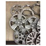 Collection of Assorted Plastic Hubcaps and Wheel Covers