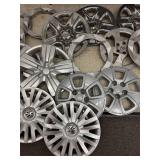 Collection of Assorted Plastic Hubcaps and Wheel Covers