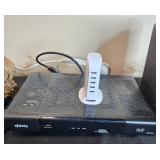 Collection of Xfinity Modems, Cisco Cable Boxes, USB Charger, Remotes, and Decorative Clock