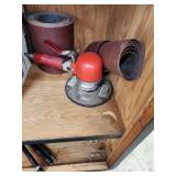 Cabinet with Power Tools, Circular Saws, Sanders, and Sandpaper Rolls