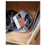 Cabinet with Power Tools, Circular Saws, Sanders, and Sandpaper Rolls