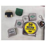 Collection of Vintage and Modern Tape Measures with Metal Storage Box