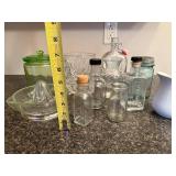 Collection of Vintage Glass Jars, Bottles, Juicer, and White Pitcher