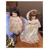 Assorted Collectibles: Porcelain Dolls, Glass Hen Dish, Birdhouse, and Decorative Figurines