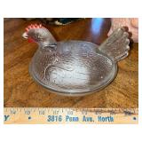 Assorted Collectibles: Porcelain Dolls, Glass Hen Dish, Birdhouse, and Decorative Figurines