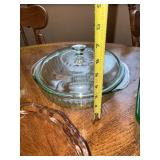 Vintage Glassware Collection Including Pink Depression Glass Plates and Green Bakeware