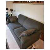 Pull-Out Sofa Bed with Plaid Accent Pillows