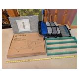 Quilting and Sewing Supply Lot with Wool Pressing Mat, Singer Quilting Table, Storage Cases and Thread Rack