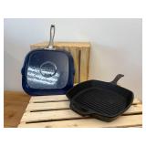 2 10-inch Cast Iron Griddles - 1 has blue enameled bottom