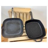 2 10-inch Cast Iron Griddles - 1 has blue enameled bottom