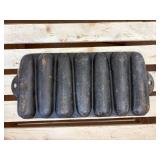 3 cast-iron pieces- corncob cornbread pan, serving skillet, and a flat round skillet