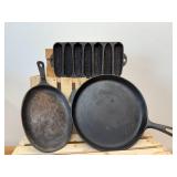 3 cast-iron pieces- corncob cornbread pan, serving skillet, and a flat round skillet