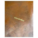 Two vintage Italian leather wrapped decanter bottles made in Italy