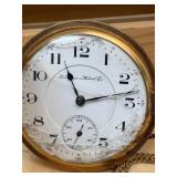 Working Hampden railroad pocket watch with engraved cabin motif