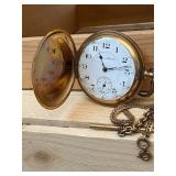 Working Hampden railroad pocket watch with engraved cabin motif