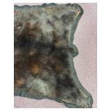 5-foot-long black bear pelt on felt