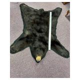 5-foot-long black bear pelt on felt