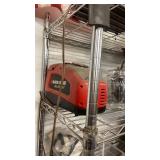 Mixed Electronics and Household Lot Including Black & Decker Charger, Emergency Jump Starter, Radios, and More