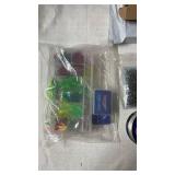 Fishing Tackle Lot Including Lures, Jig Heads, Hooks, and Fishing Line