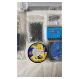 Fishing Tackle Lot Including Lures, Jig Heads, Hooks, and Fishing Line