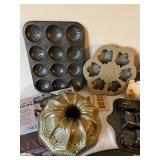 Collection of Specialty Baking Pans and Molds with Cookie Cutters and Cake Accessories