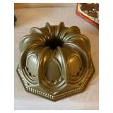 Collection of Specialty Baking Pans and Molds with Cookie Cutters and Cake Accessories