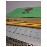 Crafting and Sewing Supplies with Books and Fabrics