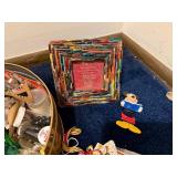 Assorted Craft Supplies and Decorative Items in Tin