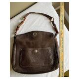 Coach Leather Handbag with Signature Design