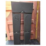 2 Polk Audio RT600i floor standing tower speakers and 1 Polk Audio CS400i center channel speaker.