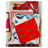 LR - Collection of Holiday Gift Wrap, Gift Bags, and Wrapping Accessories in Storage Bins