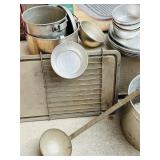 LR - Vintage Camp Cookware Collection with Cast Iron, Percolator, Lantern, and Steamer Kettle