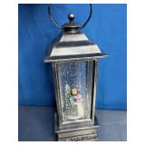 Snow Globe Lantern with a Snowman Scene Inside.