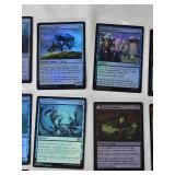 Magic: The Gathering Foil Cards Including Copycrook, Depth Defiler, and Reflective Golem with copyright years including 2021 and 2024