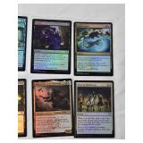 Magic: The Gathering Foil Cards Including Copycrook, Depth Defiler, and Reflective Golem with copyright years including 2021 and 2024