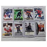 Lot of 8 Hockey Cards All in Magnetic One Touch Cases Featuring Key Players Including Leon Draisaitl, Cale Makar, and Matty Beniers