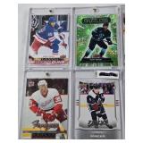 Lot of 8 Hockey Cards All in Magnetic One Touch Cases Featuring Key Players Including Leon Draisaitl, Cale Makar, and Matty Beniers