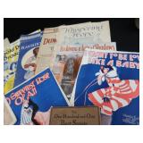 2 VINTAGE BRASS FRENCH HORNS PLUS SHEET MUSIC.