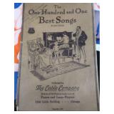 2 VINTAGE BRASS FRENCH HORNS PLUS SHEET MUSIC.