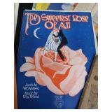 2 VINTAGE BRASS FRENCH HORNS PLUS SHEET MUSIC.