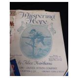 2 VINTAGE BRASS FRENCH HORNS PLUS SHEET MUSIC.