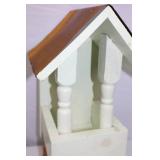 Painted Wood Wall Shelf with Spindle Supports and Brown Roof Accent