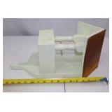 Painted Wood Wall Shelf with Spindle Supports and Brown Roof Accent