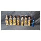 Set of 7 Vintage Cabin Still and Old Fitzgerald Wildlife Bourbon Decanters with 1 Blue Decorative Glass Bottle