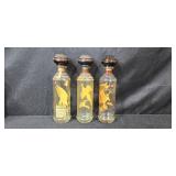 Set of 7 Vintage Cabin Still and Old Fitzgerald Wildlife Bourbon Decanters with 1 Blue Decorative Glass Bottle