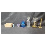 Collection of Vintage Glass Bottles, Brass Candlestick Holders, and Decorative Containers